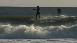 Presidential candidate Tulsi Gabbard goes surfing [upl. by Iatnwahs]